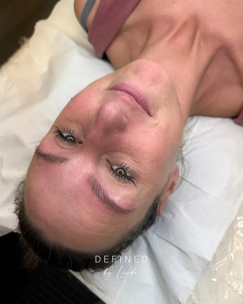 A client showing her soft powder brow result